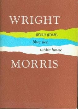 Green grass, blue sky, white house